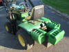 Deere 317 tractor with loader and weights