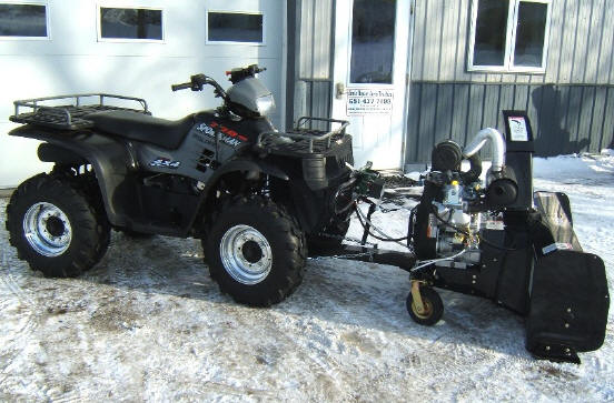 How do you attach a snow blower to a 4 wheeler?